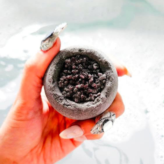 Black hole bath bomb with crystal Epsom salt infused moisturising ingredients